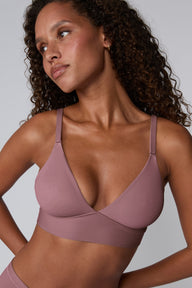 Front view of the Bliss Triangle Bralette in Mirage on model, showing the smooth triangle cups and adjustable thin straps. sizing: Courtney wears size Small