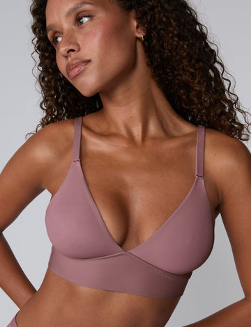 Front view of the Bliss Triangle Bralette in Mirage on model, showing the smooth triangle cups and adjustable thin straps. sizing: Courtney wears size Small