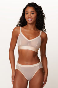 Close up of Ally wearing the ComfortMesh Triangle Bralette in Pearl. The front adjustable straps and triangle neckline are emphasized. sizing: Ally wears a size Small. 