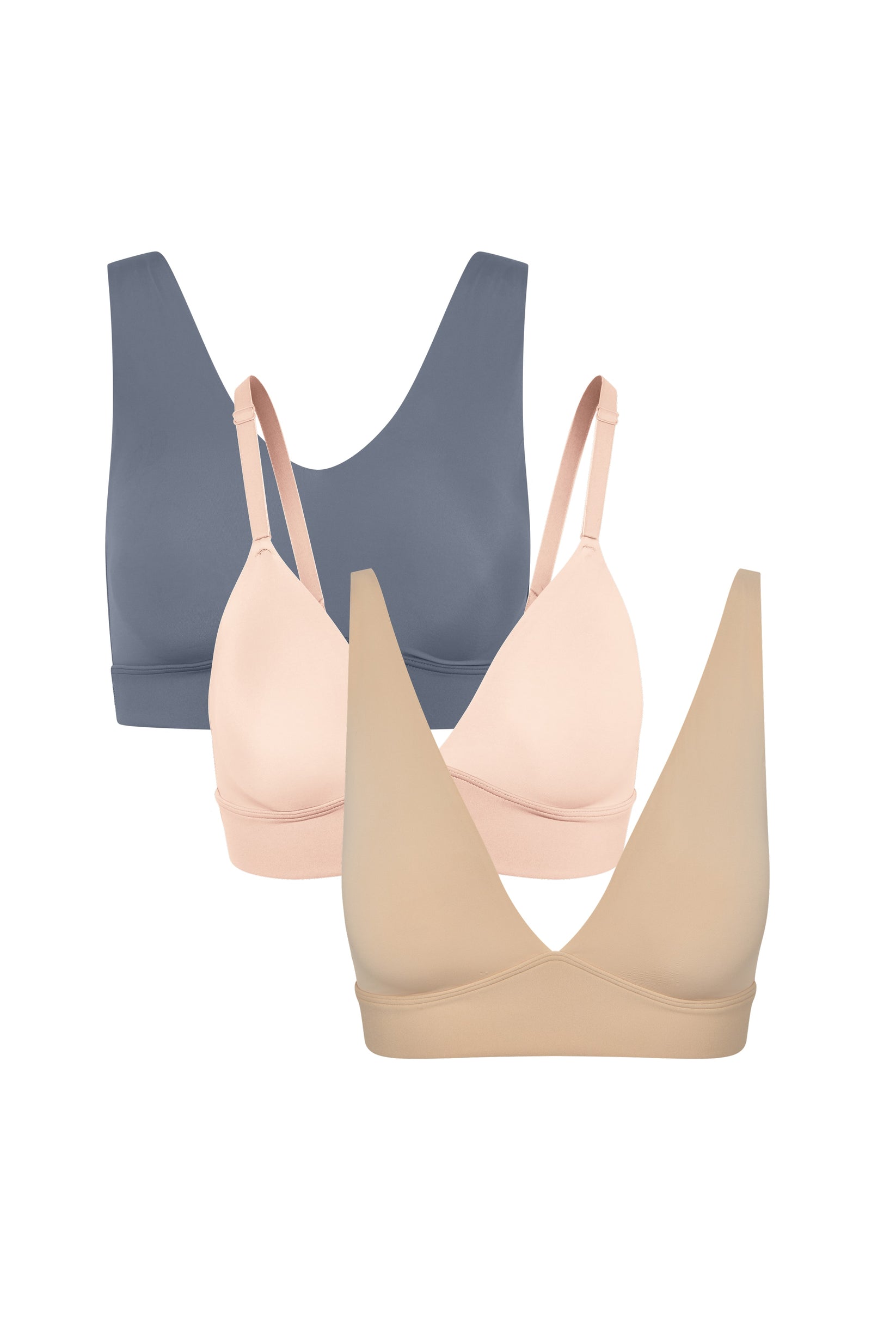 Three wireless bralettes shown in a staggered lineup on a white background, featuring Bliss in Steel, Bliss Triangle in Rose and Bliss Plunge Adjustable in Beige