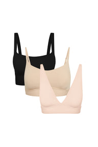 Product shot of Harper Wilde The Fall Bralette Edit — Bliss Square Neck Bralette in Black, Bliss Scoop Adjustable Bralette in Beige, and Bliss Plunge Adjustable Bralette in Rose, three wireless everyday bralettes for fall layering