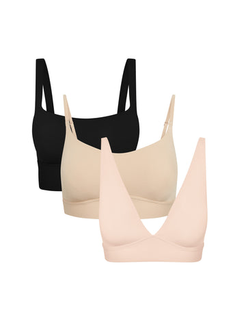 Product shot of Harper Wilde The Fall Bralette Edit — Bliss Square Neck Bralette in Black, Bliss Scoop Adjustable Bralette in Beige, and Bliss Plunge Adjustable Bralette in Rose, three wireless everyday bralettes for fall layering