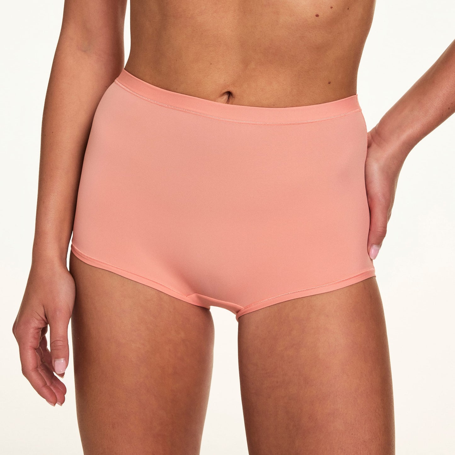 In a close-up studio image, Gianna wears the Bliss Boyshort in Cabana, showcasing the smooth fabric, high-rise silhouette, and soft waistband.