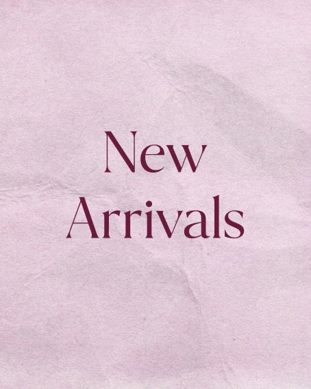 Blush pink crumpled paper background with text: "New Arrivals"