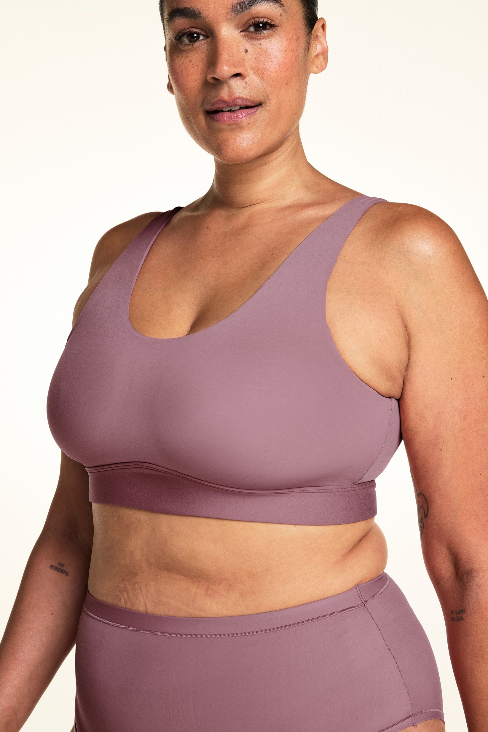 Three-quarter view of the Bliss Scoop Adjustable Bralette in Mirage, showing the wide supportive band and adjustable strap detail