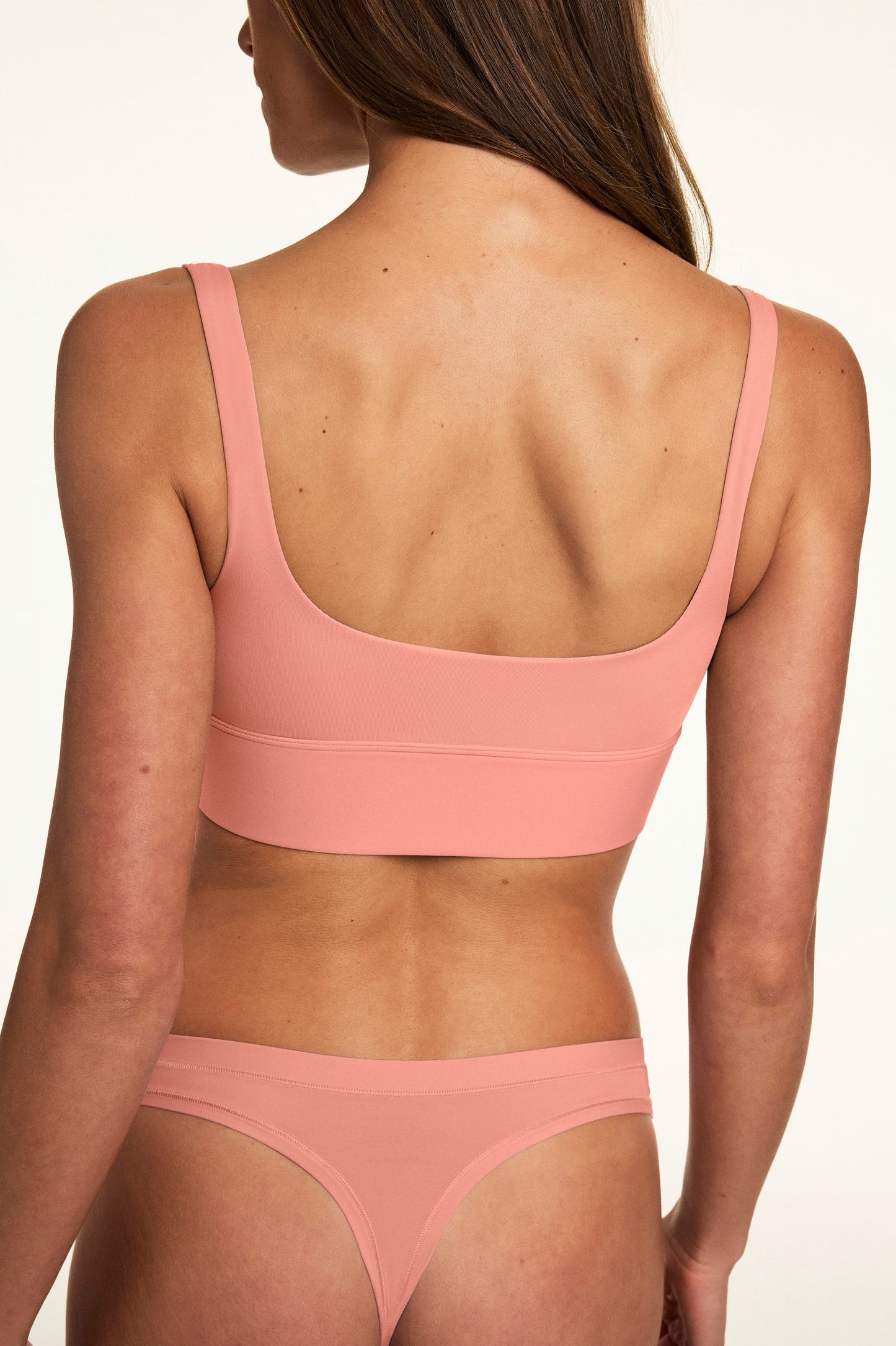From the back, Gianna wears the Bliss Squareneck Bralette in Cabana with matching underwear, showing the scoop-back design and wide underband.