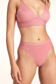 Side view of Bliss Thong in Cinnamon showing high-cut leg opening and wide waistband, paired with Bliss Triangle Bralette in Cinnamon