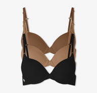 A trio of Harper Wilde's best selling Base T-Shirt Bra in Brown, Tan, and Black against a white background.