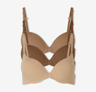 A trio of Harper Wilde's Base T-Shirt Bras in Tan, Brown, and Beige against a white background.