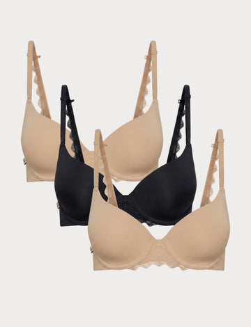 Flat lay image of 3 Base Lace T-Shirt Bras in Beige and Black showcasing the soft lace detail at the center and along the back strap.
