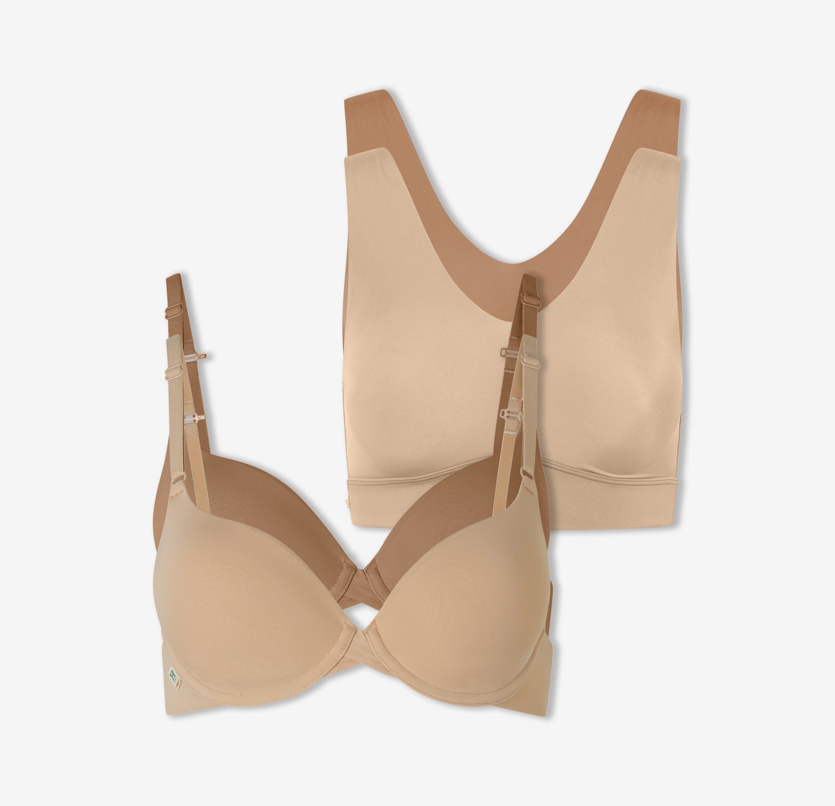 A duo of Harper Wilde's Bliss Bralettes in Beige and Tan and a duo of the Base T-Shirt Bra in the same colors against a white background.