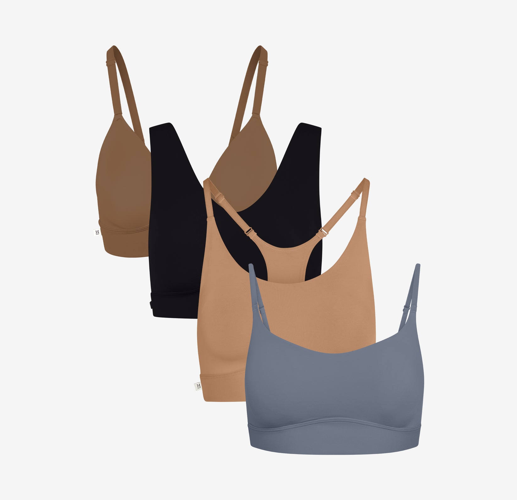 Harper Wilde's Bliss Triangle Bralette in Brown, Bliss Braeltte in Black, Bliss Racerback Bralette in Tan, and Bliss Scoop Bralette in Steel against a white background. 