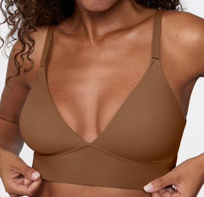 Model wearing the Harper Wilde Bliss Triangle Bralette in Brown — wire-free triangle bralette with deep V-neckline, adjustable straps, and wide underband.
