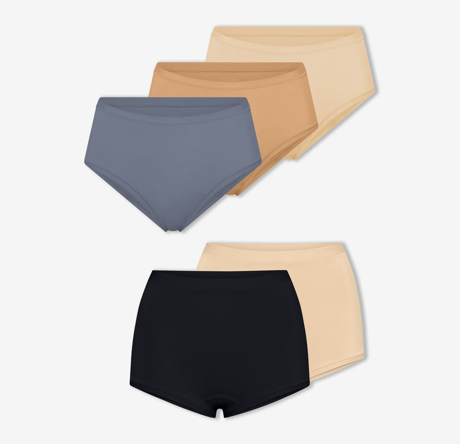 A trio of Harper Wilde's Bliss Highwaist Briefs in Steel, Beige, and Tan along with a duo of Bliss Boyshorts in Beige and Black against a white background.