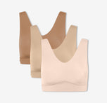 A trio of Harper Wilde's Bliss Bralettes in Tan, Beige, and Rose against a white background.