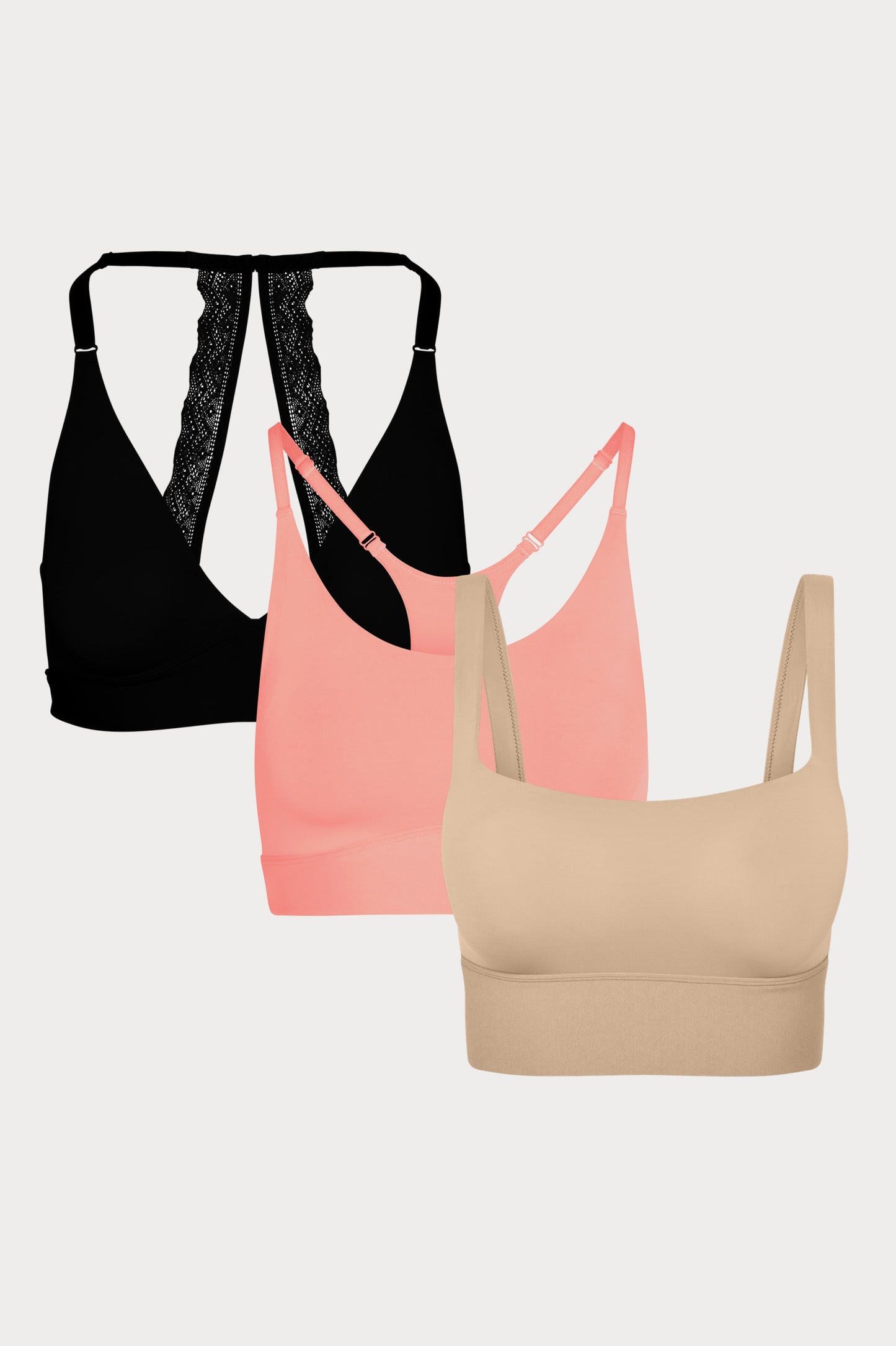 Three Bliss bralettes displayed together: the Lace Halterneck in Black, the Racerback in Cabana, and the Squareneck in Beige, showing front and back details.