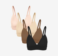 Four of Harper Wilde Bliss Triangle Bralettes in Rose, Beige, Brown, and Black— offering wireless support and comfort.