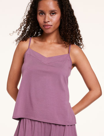In a studio setting, Courtney wears the Cloud Cotton tank in Mirage, featuring a soft V-neckline, thin adjustable straps, and lightweight, breathable fabric. sizing: Courtney wears size Small
