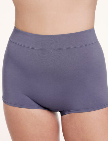 On a white studio backdrop, Sonnie wears the Cloud Cotton Boyshort in Slate, shown from the front with a high-rise fit and full coverage in soft, breathable cotton modal fabric.