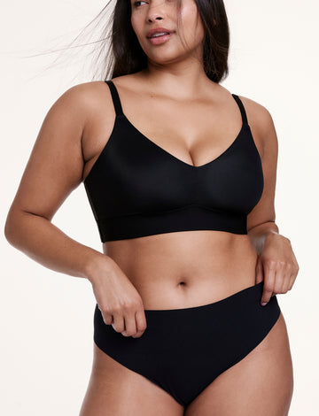 Three-quarter front view of the No-Show High Waist Thong in Black, showing the high-rise fit and soft, second-skin fabric.