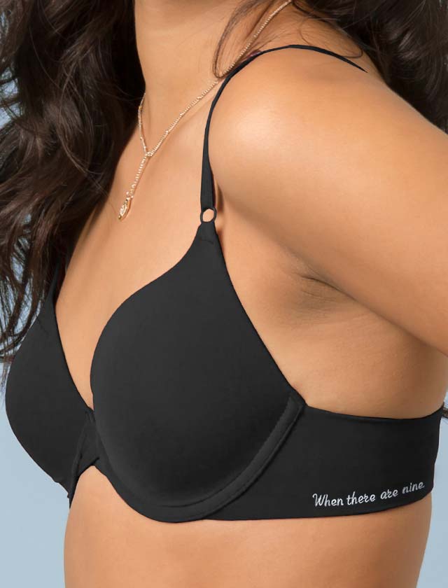 Woman wearing Bra with RBG Quote embroidered on the side