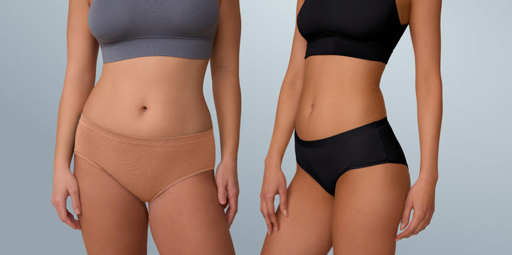 Two models standing against a light blue background. The leftmost model wears the Cloud Cotton Thin Strap Bralette and Bliss Hiphugger in Dune. The rightmost model wears the Bliss Bralette and Bliss Hiphugger in Black. 