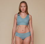 Model wearing the Bliss Bralette and the Bliss Hiphugger in the color Mist. sizing:Erin wears size Small