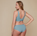 Model wearing the Bliss Bralette and the Bliss Hiphugger in the color Mist.