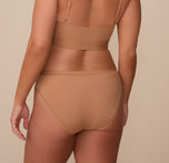 Back view of Sonnie in the Bliss Bikini in Tan. The full coverage back and soft, microfiber material provide maximum comfort. 