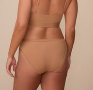 Back view of Sonnie in the Bliss Bikini in Tan. The full coverage back and soft, microfiber material provide maximum comfort. 