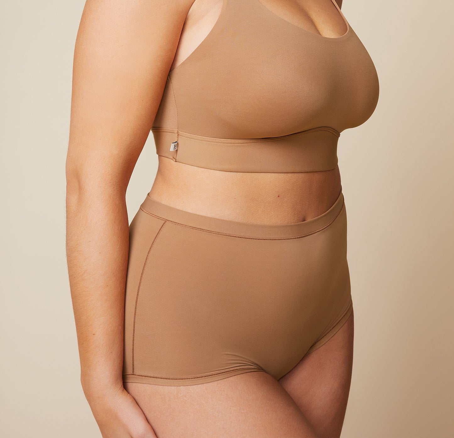 Close up front view of the Bliss Boyshort in Tan.