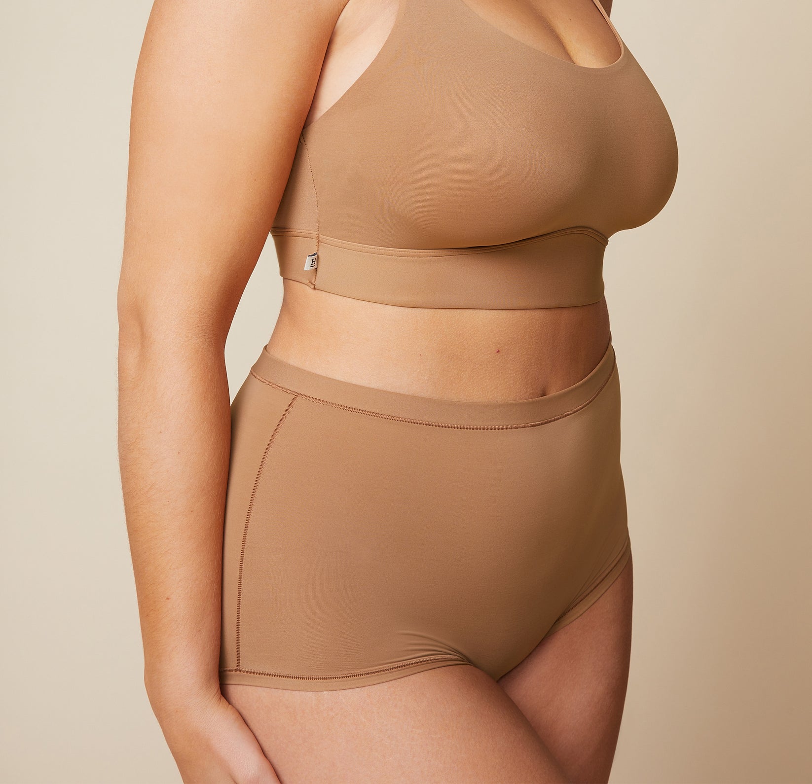 Close up front view of the Bliss Boyshort in Tan.