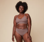 Model Akesha wearing the Bliss Lace Highwaist Brief in Mauve, paired with the matching Bliss Lace Halterneck Bralette. She stands facing forward, highlighting the comfortable, full-coverage fit of the highwaist brief and the supportive bralette.