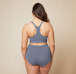 A back view of Summerlyn wearing the Bliss Racerback Bralette in Steel and the Bliss Boyshort in Steel. The image highlights the racerback design of the bralette and the full coverage provided by the boyshort.