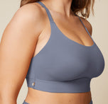 A close-up side view of the Bliss Racerback Bralette in Steel, worn by Summerlyn. The image focuses on the soft fabric and the comfortable fit of the bralette.