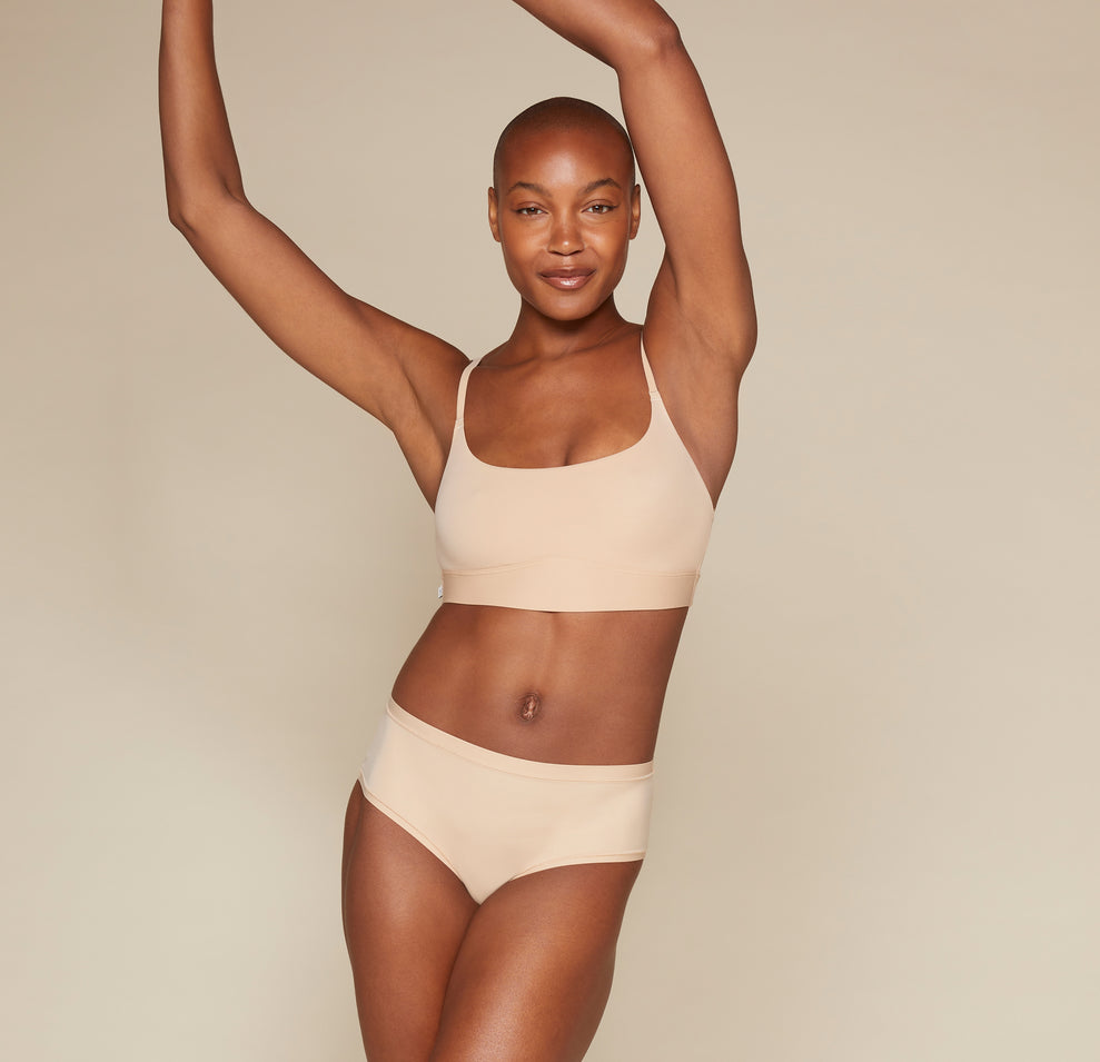 Woman wearing the Bliss Scoop Bralette in the color Beige 