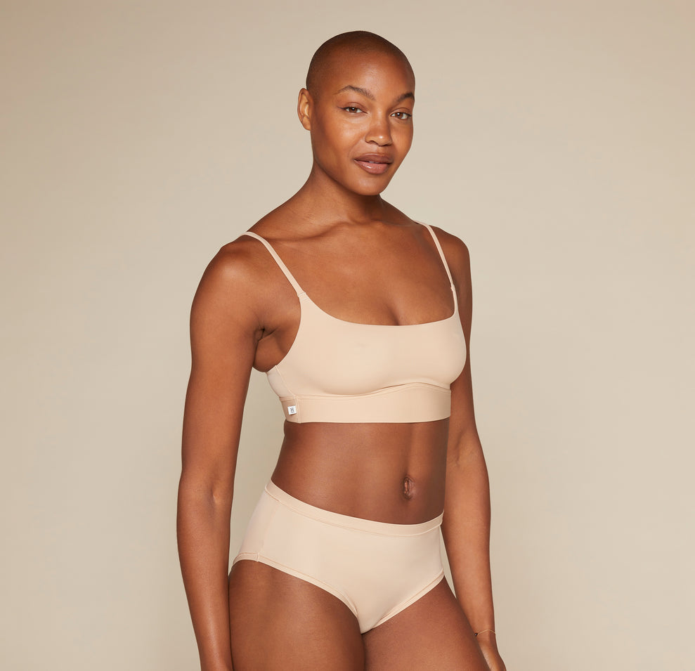 Woman wearing the Bliss Scoop Bralette in the color Beige 