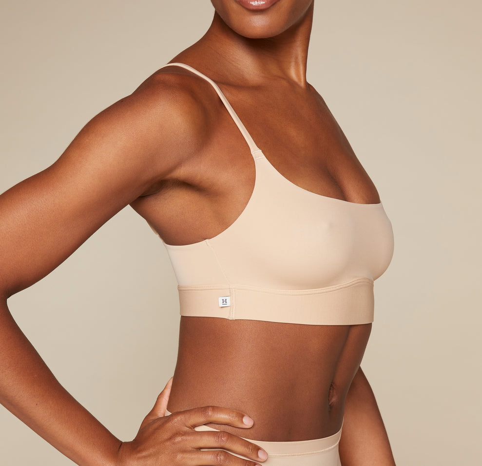 Woman wearing the Bliss Scoop Bralette in the color Beige sizing: Danah wears size Small