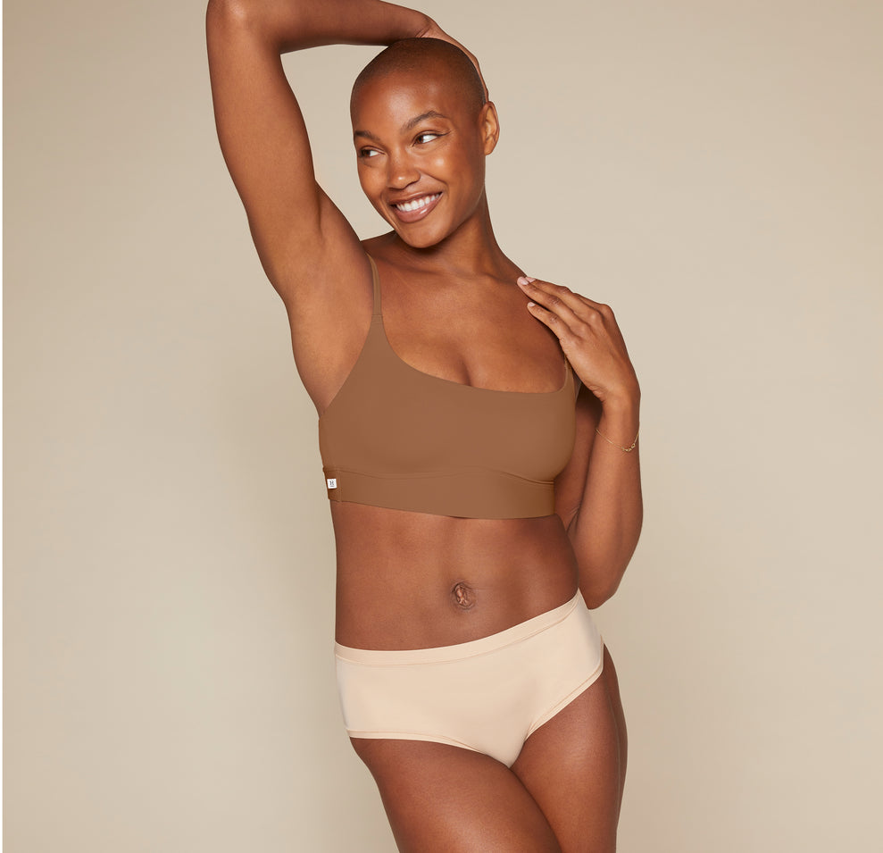 Woman wearing the Bliss Scoop Bralette in the color Brown sizing: Danah wears size Small