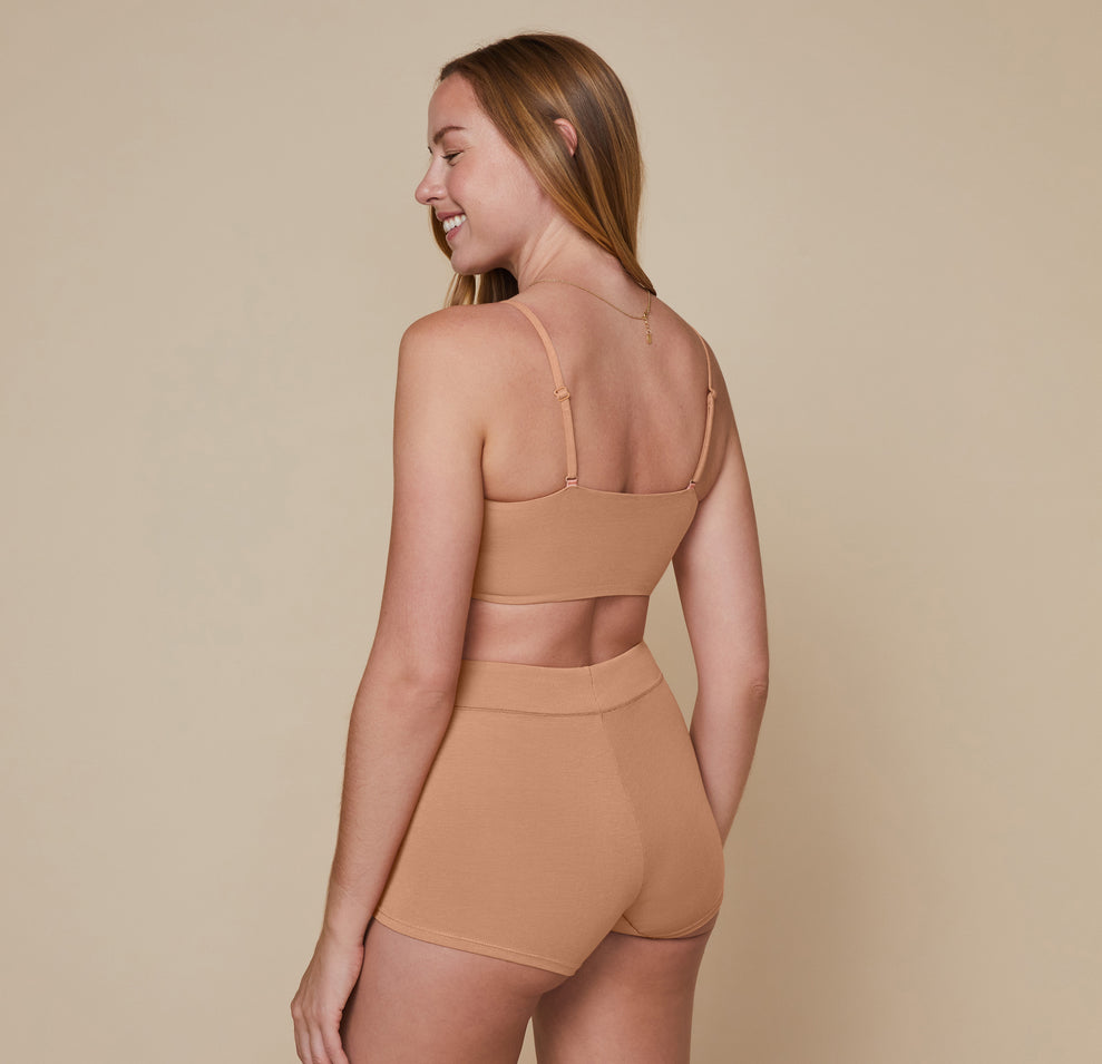Back view of model wearing the Cloud Cotton Triangle Bralette showing the adjustable bralette straps.