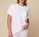 Model Megan in the Cloud Cotton Tee in White and Cloud Cotton Logo Boxer Brief in White, pulling the hem slightly to showcase the soft, breathable fabric. sizing: Megan wears size Small