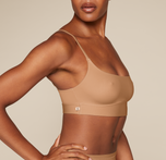 Woman wearing the Bliss Scoop Bralette in the color Tan