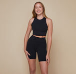 Model wearing the Flex Racerback Sport Tank with the matching Flex High Rise Bike Shorts in black.