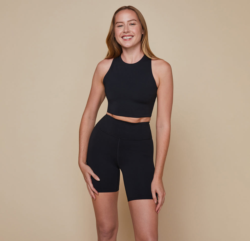 Model wearing the Flex Racerback Sport Tank with the matching Flex High Rise Bike Shorts in black.