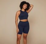 Model wearing the Flex Racerback Tank in the color Ink with the matching Flex High Rise Bikeshort.