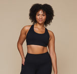 Model wearing the Flex Crossback Convertible Sports Bra and matching Flex High Rise Leggings in Black. sizing: Alexandra wears size XL
