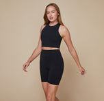 Model wearing the Flex Racerback Tank in the color Black with the matching Flex High Rise Bikeshort.