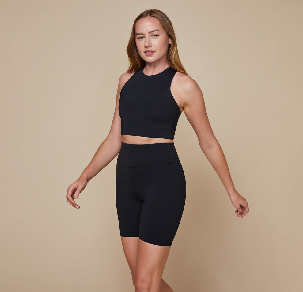 Model wearing the Flex Racerback Tank in the color Black with the matching Flex High Rise Bikeshort.