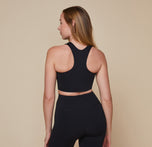 Model wearing the Flex Racerback Tank in the color Black with the matching Flex High Rise Bikeshort.