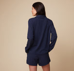 Side view of model Anna wearing the Pima PJ Longsleeve and Pima PJ Shorts in Navy, showcasing the relaxed and easy fit of the soft loungewear.